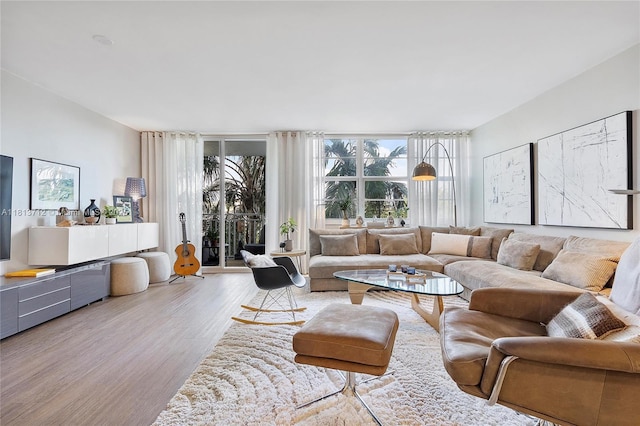 2150 Sans Souci Blvd Unit B311, North Miami, FL 33181 - living area with wood finished floors and floor to ceiling windows