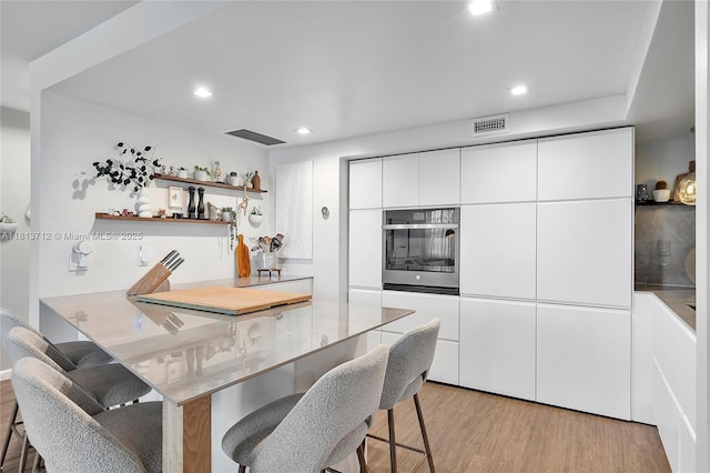 2150 Sans Souci Blvd Unit B311, North Miami, FL 33181 - dining room featuring light wood-style flooring and recessed lighting