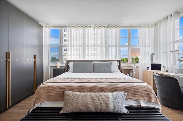 2150 Sans Souci Blvd Unit B311, North Miami, FL 33181 - bedroom featuring wood finished floors
