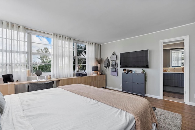 2150 Sans Souci Blvd Unit B311, North Miami, FL 33181 - bedroom featuring multiple windows, wood finished floors, and baseboards
