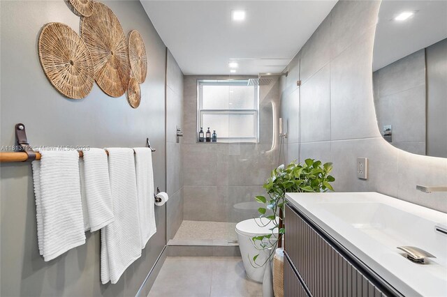 2150 Sans Souci Blvd Unit B311, North Miami, FL 33181 - full bath with toilet, walk in shower, vanity, tile walls, and tile patterned flooring