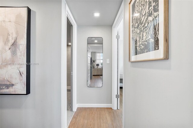 2150 Sans Souci Blvd Unit B311, North Miami, FL 33181 - corridor with wood finished floors and baseboards