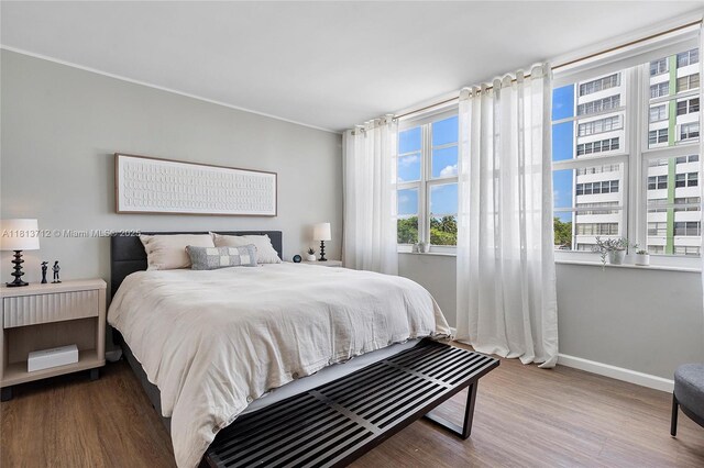 2150 Sans Souci Blvd Unit B311, North Miami, FL 33181 - bedroom with baseboards and wood finished floors