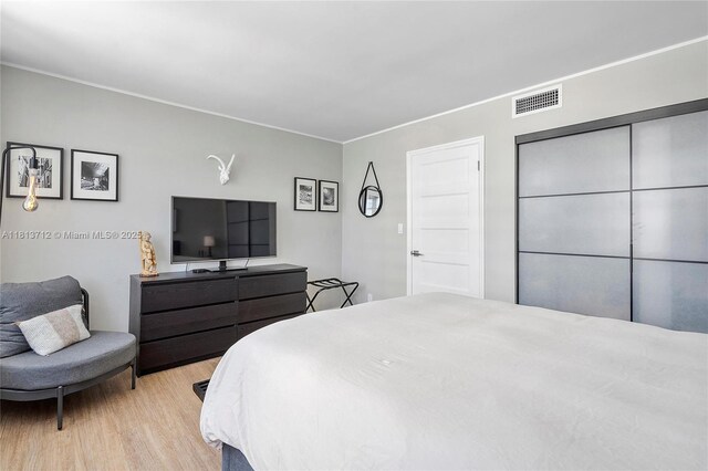 2150 Sans Souci Blvd Unit B311, North Miami, FL 33181 - bedroom with wood finished floors and ornamental molding