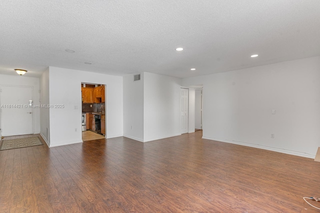 17051 NE 35th Ave Unit 109, North Miami Beach, FL 33160 - spare room featuring recessed lighting, dark wood-style flooring, a textured ceiling, and baseboards