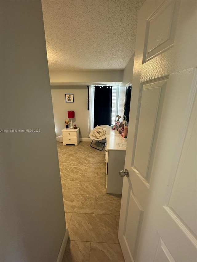 4706 25th Ave SW, Naples, FL 34116 - hall with a textured ceiling and light tile patterned flooring