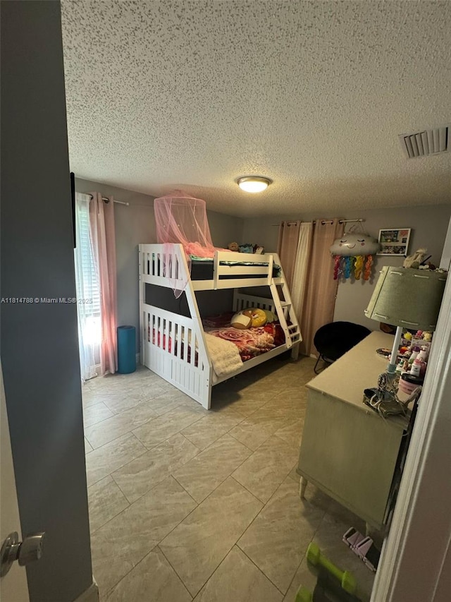 4706 25th Ave SW, Naples, FL 34116 - bedroom with a textured ceiling