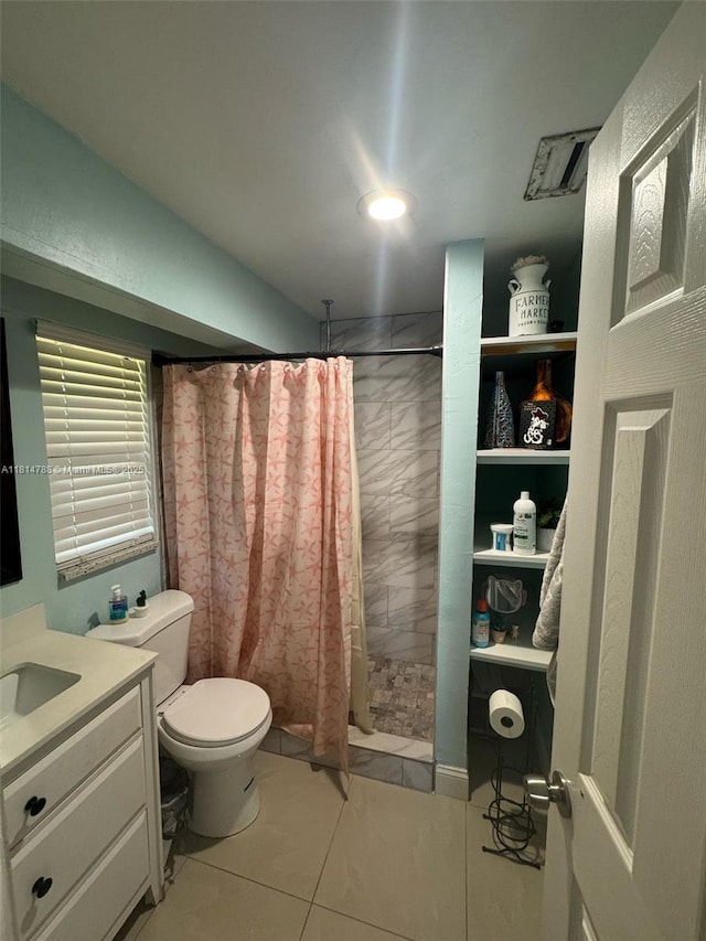 4706 25th Ave SW, Naples, FL 34116 - full bath featuring a tile shower, toilet, vanity, and tile patterned floors