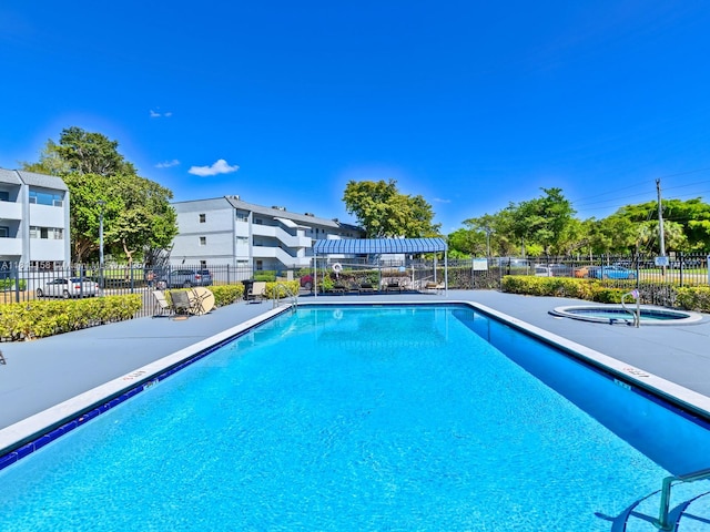 8401 Lagos De Campo Blvd Unit 210V, Tamarac, FL 33321 - community pool featuring a hot tub and a patio area