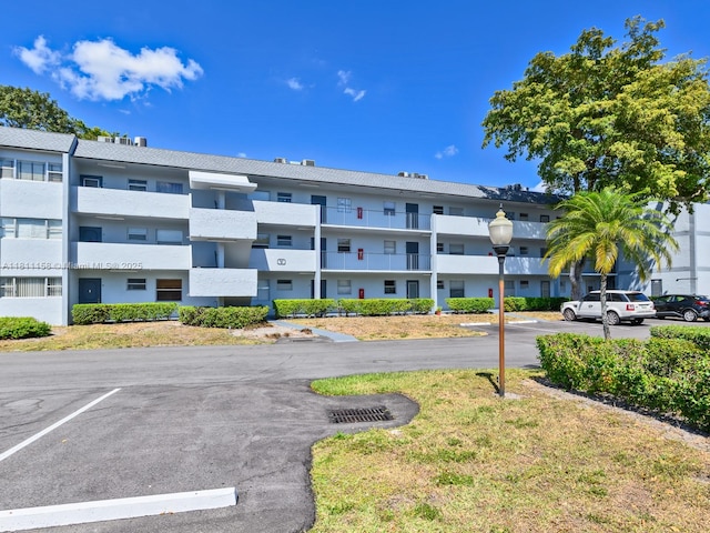 8401 Lagos De Campo Blvd Unit 210V, Tamarac, FL 33321 - view of apartment building / complex featuring uncovered parking