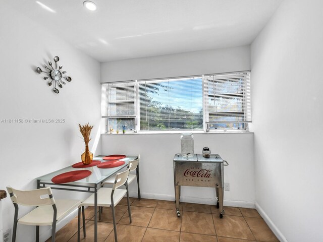 8401 Lagos De Campo Blvd Unit 210V, Tamarac, FL 33321 - tiled dining room with baseboards