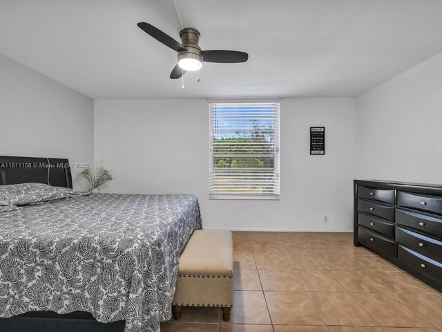 8401 Lagos De Campo Blvd Unit 210V, Tamarac, FL 33321 - tiled bedroom featuring ceiling fan and baseboards