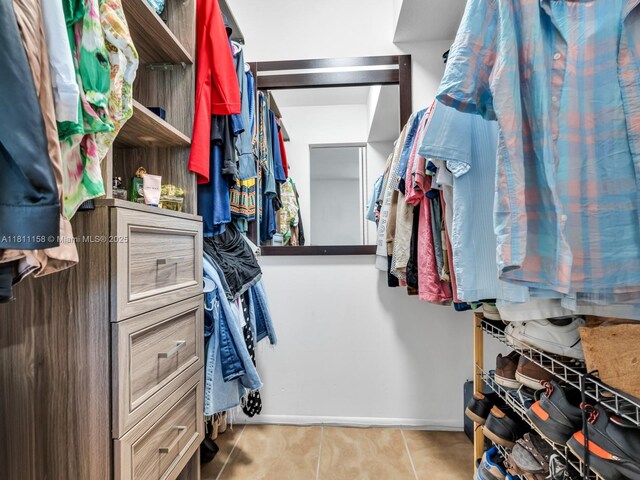 8401 Lagos De Campo Blvd Unit 210V, Tamarac, FL 33321 - walk in closet featuring tile patterned flooring