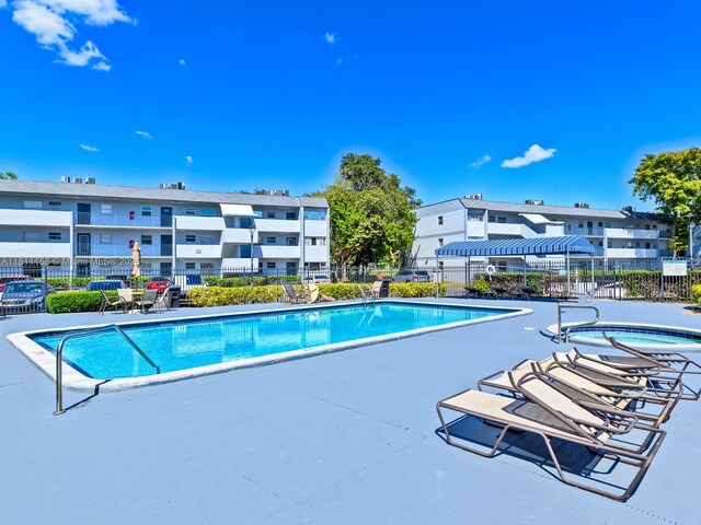 8401 Lagos De Campo Blvd Unit 210V, Tamarac, FL 33321 - community pool with a patio area and a residential view