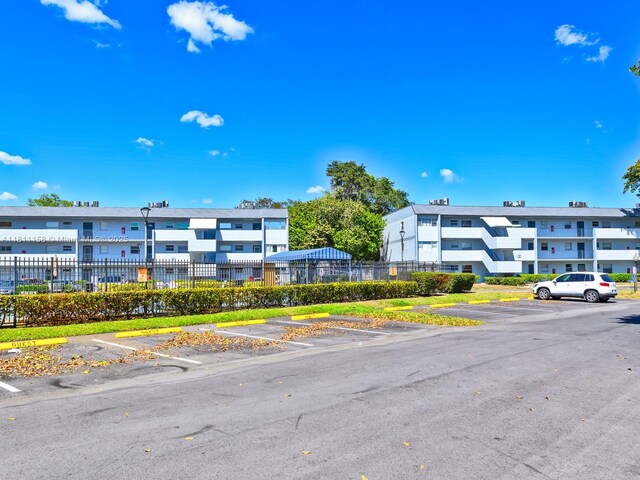 8401 Lagos De Campo Blvd Unit 210V, Tamarac, FL 33321 - view of building exterior featuring uncovered parking