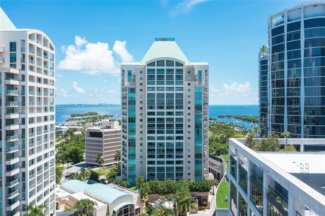 3400 SW 27th Ave Unit 1904, Coconut Grove, FL 33133 - view of building exterior featuring central AC, a water view, and a view of city
