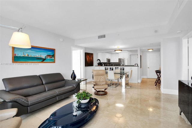 3400 SW 27th Ave Unit 1904, Coconut Grove, FL 33133 - living room featuring light marble finish floors and baseboards