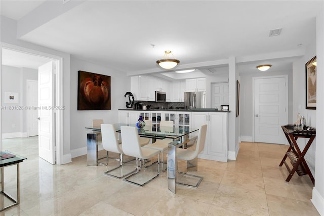 3400 SW 27th Ave Unit 1904, Coconut Grove, FL 33133 - dining area featuring baseboards and light tile patterned flooring