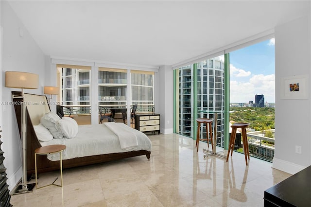 3400 SW 27th Ave Unit 1904, Coconut Grove, FL 33133 - bedroom with floor to ceiling windows, a view of city, and baseboards
