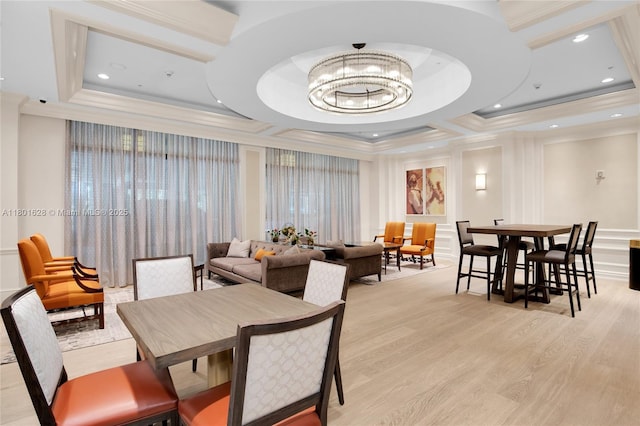3400 SW 27th Ave Unit 1904, Coconut Grove, FL 33133 - dining area featuring crown molding, light wood-style floors, a tray ceiling, a chandelier, and a decorative wall