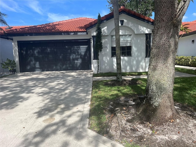 18428 Via Di Regina, Boca Raton, FL 33496 - mediterranean / spanish-style house featuring a tile roof, a garage, concrete driveway, and stucco siding