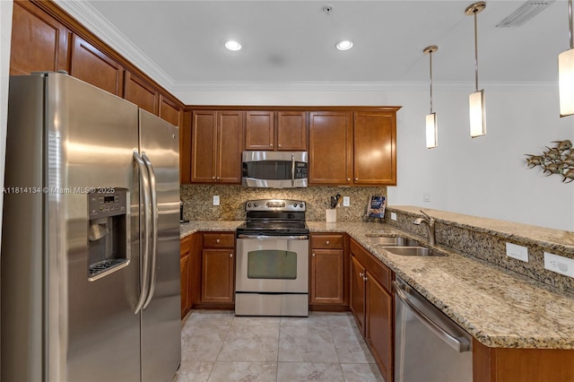 12441 Emerald Creek Mnr, Plantation, FL 33325 - kitchen with stainless steel appliances, a sink, crown molding, a peninsula, and brown cabinetry