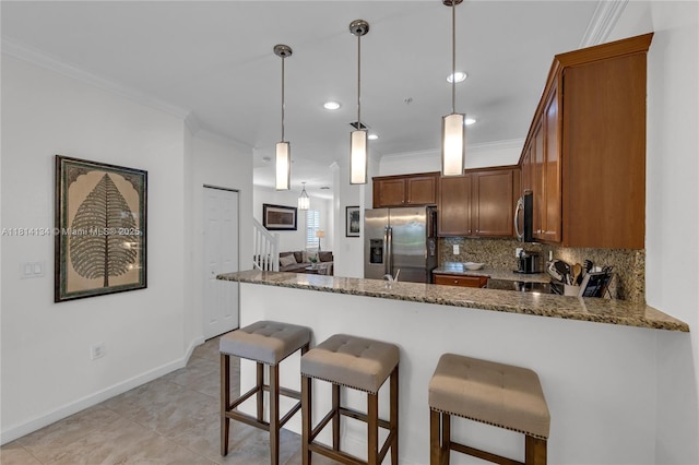 12441 Emerald Creek Mnr, Plantation, FL 33325 - kitchen with appliances with stainless steel finishes, a peninsula, ornamental molding, tasteful backsplash, and dark stone counters