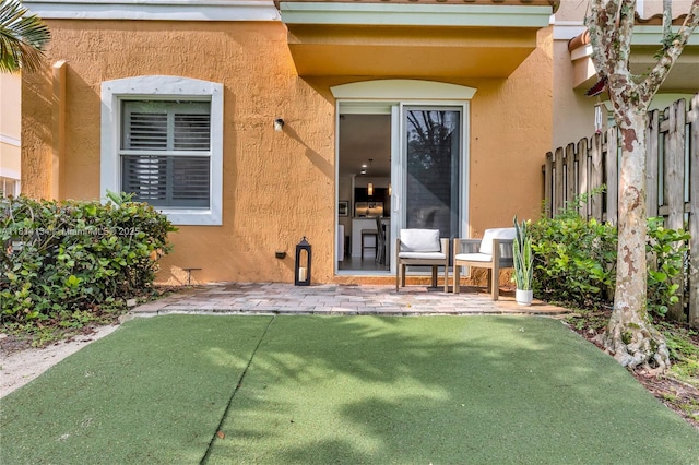 12441 Emerald Creek Mnr, Plantation, FL 33325 - entrance to property featuring stucco siding and a patio area