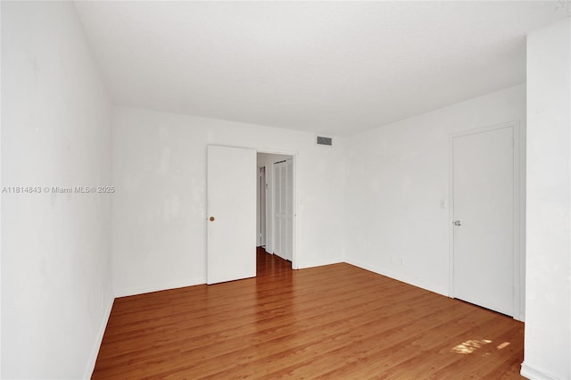 2591 Trapp Ave Unit 4, Miami, FL 33133 - unfurnished room with light wood-style flooring and baseboards