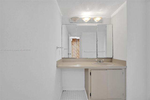 2591 Trapp Ave Unit 4, Miami, FL 33133 - bathroom featuring vanity, tile patterned floors, and baseboards