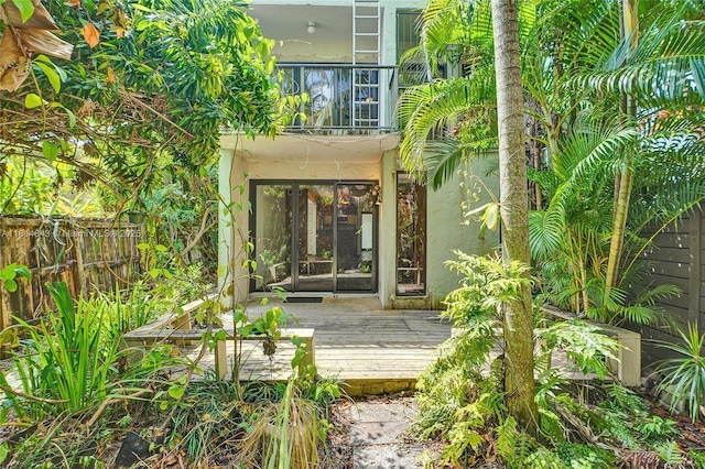 2591 Trapp Ave Unit 4, Miami, FL 33133 - rear view of property with a wooden deck and stucco siding