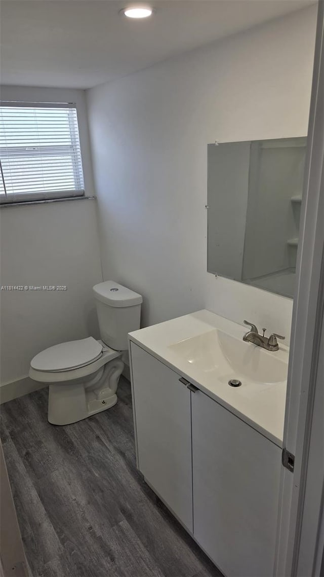2248 Marina Park Dr, Fort Myers, FL 33905 - half bath with vanity, wood finished floors, and recessed lighting
