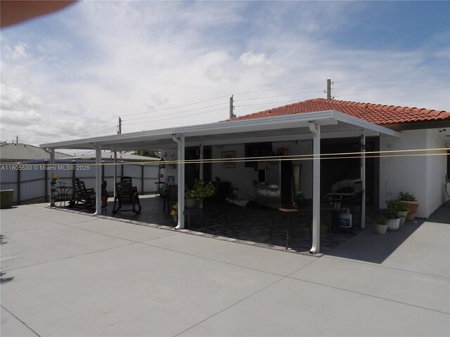 12210 SW 216th St, Miami, FL 33170 - back of house featuring a patio and a tile roof