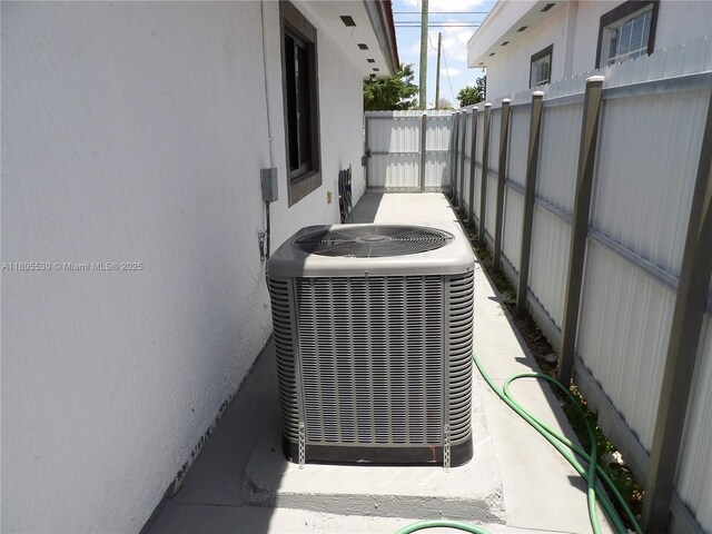 12210 SW 216th St, Miami, FL 33170 - exterior view of central air condition unit and stucco siding