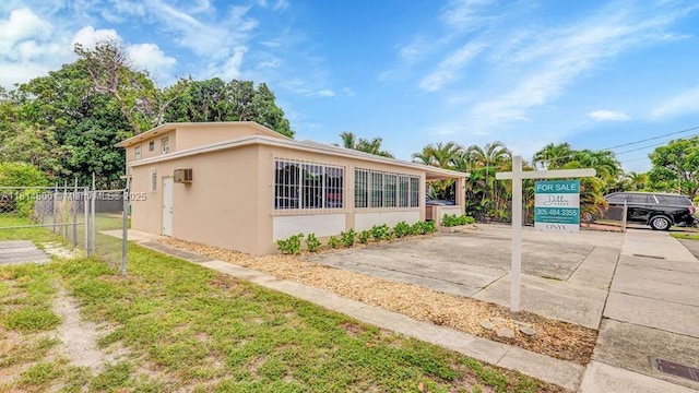 435 NW 44th Ave, Miami, FL 33126 - view of side of home featuring stucco siding