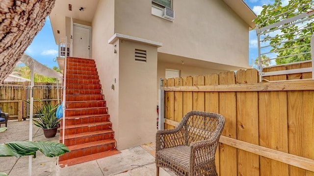 435 NW 44th Ave, Miami, FL 33126 - entrance to property featuring stucco siding and a patio area