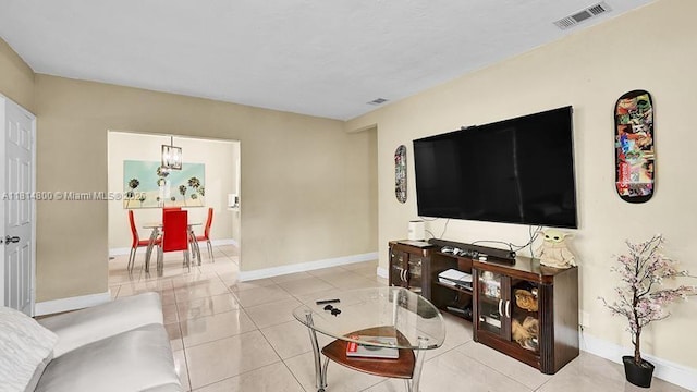 435 NW 44th Ave, Miami, FL 33126 - living area featuring light tile patterned floors and baseboards