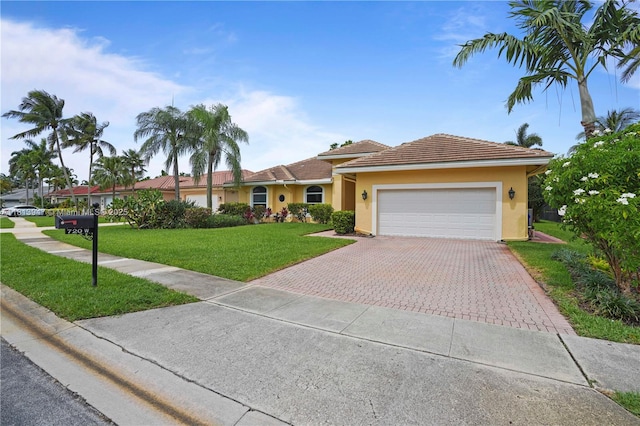720 Cypress Pointe Dr W, Pembroke Pines, FL 33027 - ranch-style house featuring driveway, a garage, stucco siding, and a front lawn