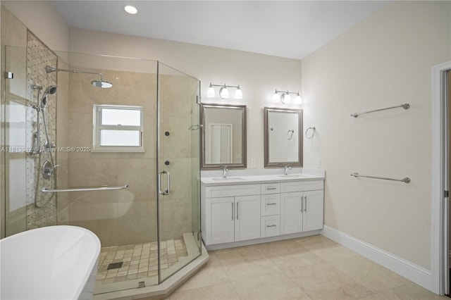 720 Cypress Pointe Dr W, Pembroke Pines, FL 33027 - full bath with double vanity, a freestanding tub, a shower stall, baseboards, and recessed lighting