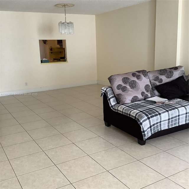 1865 S Ocean Dr Unit 10D, Hallandale Beach, FL 33009 - living room with light tile patterned floors, a chandelier, and baseboards