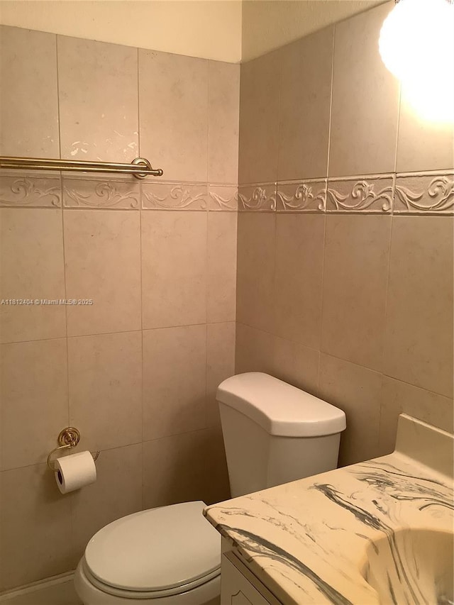 1865 S Ocean Dr Unit 10D, Hallandale Beach, FL 33009 - bathroom featuring vanity, toilet, and tile walls