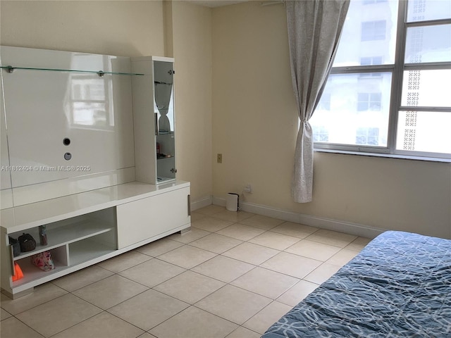 1865 S Ocean Dr Unit 10D, Hallandale Beach, FL 33009 - unfurnished bedroom with light tile patterned floors and baseboards