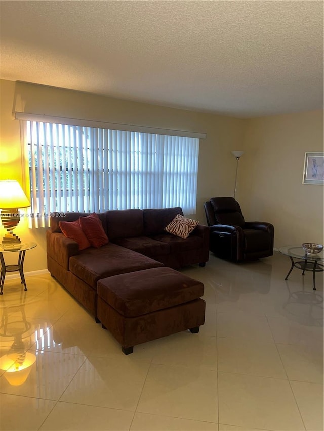3405 Bimini Ln Unit J4, Coconut Creek, FL 33066 - tiled living room with a textured ceiling