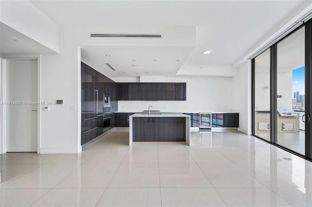 3250 NE 188th St Unit Lph07, Aventura, FL 33180 - kitchen featuring modern cabinets, oven, light tile patterned floors, a sink, and recessed lighting