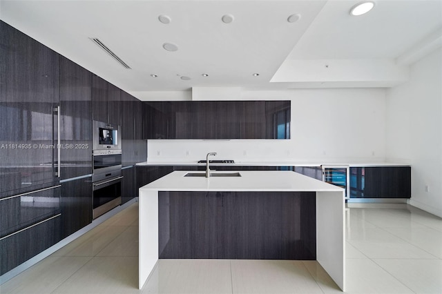 3250 NE 188th St Unit Lph07, Aventura, FL 33180 - kitchen featuring modern cabinets, wine cooler, a sink, light tile patterned flooring, and recessed lighting