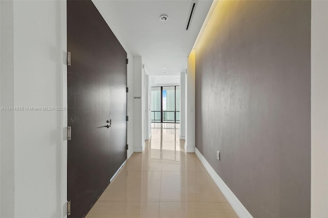 3250 NE 188th St Unit Lph07, Aventura, FL 33180 - hall with light tile patterned floors, floor to ceiling windows, and baseboards