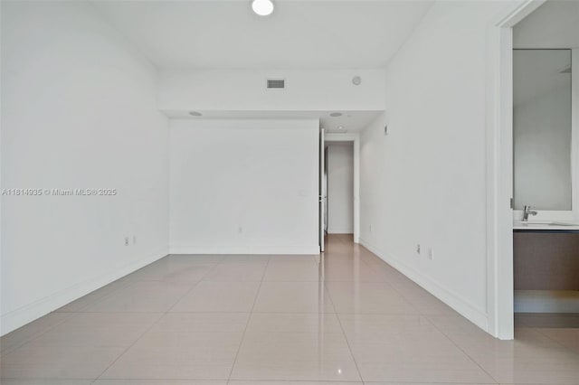 3250 NE 188th St Unit Lph07, Aventura, FL 33180 - unfurnished room featuring tile patterned flooring, baseboards, and a sink