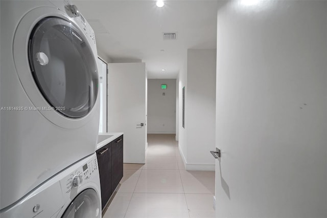 3250 NE 188th St Unit Lph07, Aventura, FL 33180 - laundry room featuring stacked washer / drying machine and light tile patterned floors