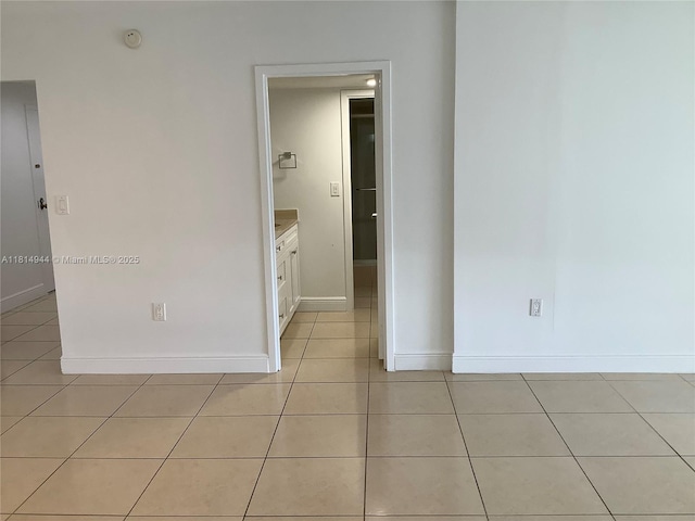 2333 Brickell Ave Unit 615, Miami, FL 33129 - empty room featuring light tile patterned flooring, baseboards, and a smoke detector