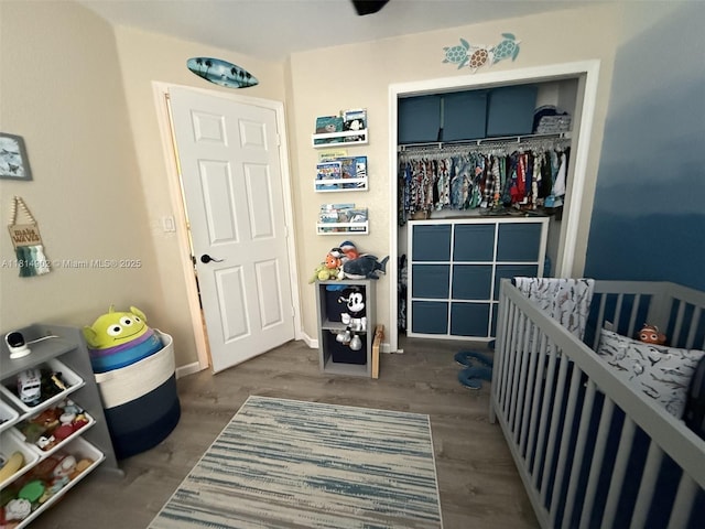 238 Magnolia Ave, Davie, FL 33325 - bedroom with a crib, a closet, and dark wood finished floors